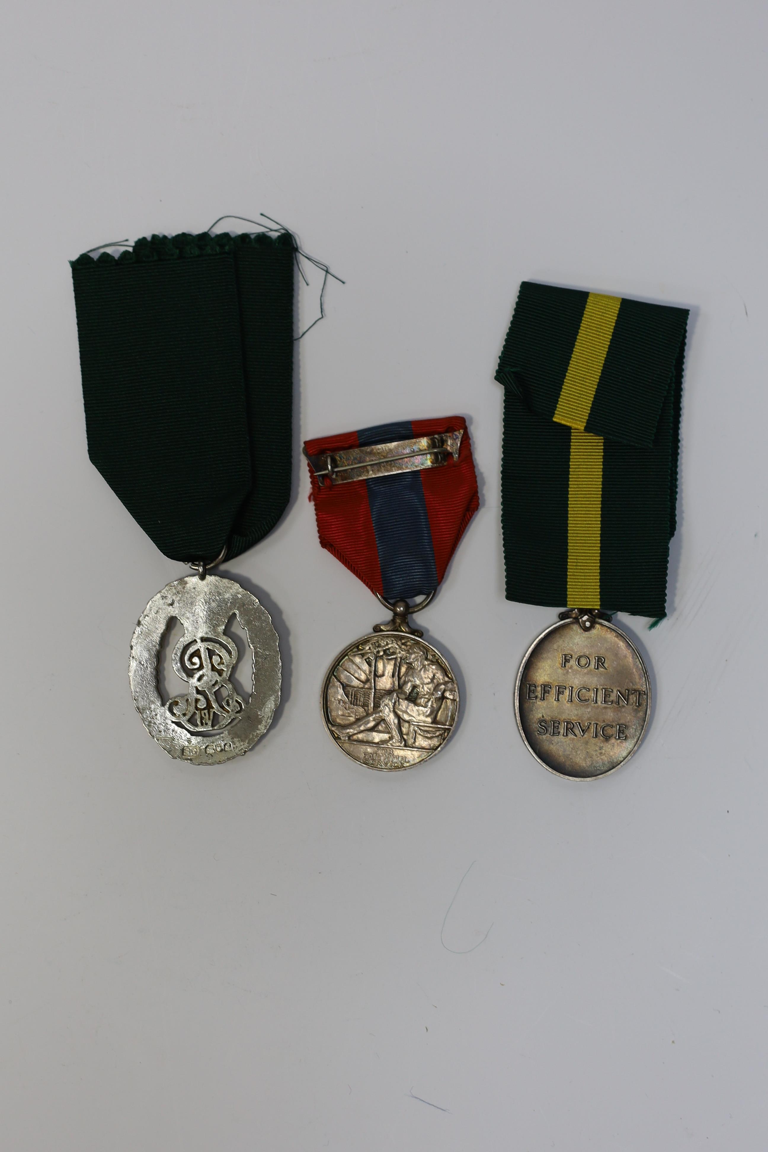 Three assorted service medals; Ed VII Volunteer Officer's Decoration hallmarked for 1905; GV Imperial Service medal to Walter Charles Cornish; GVI Territorial Efficiency medal to 2062789 . S/Sgt. L.W.Sergeant. R.A. Condi